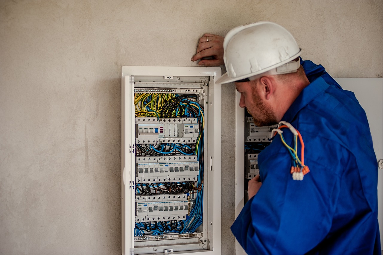 Electrician working in a breaker panel
